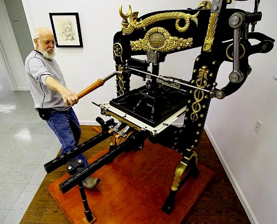 Ted Leigh demonstrates the Columbian Press at the Museum of Printing